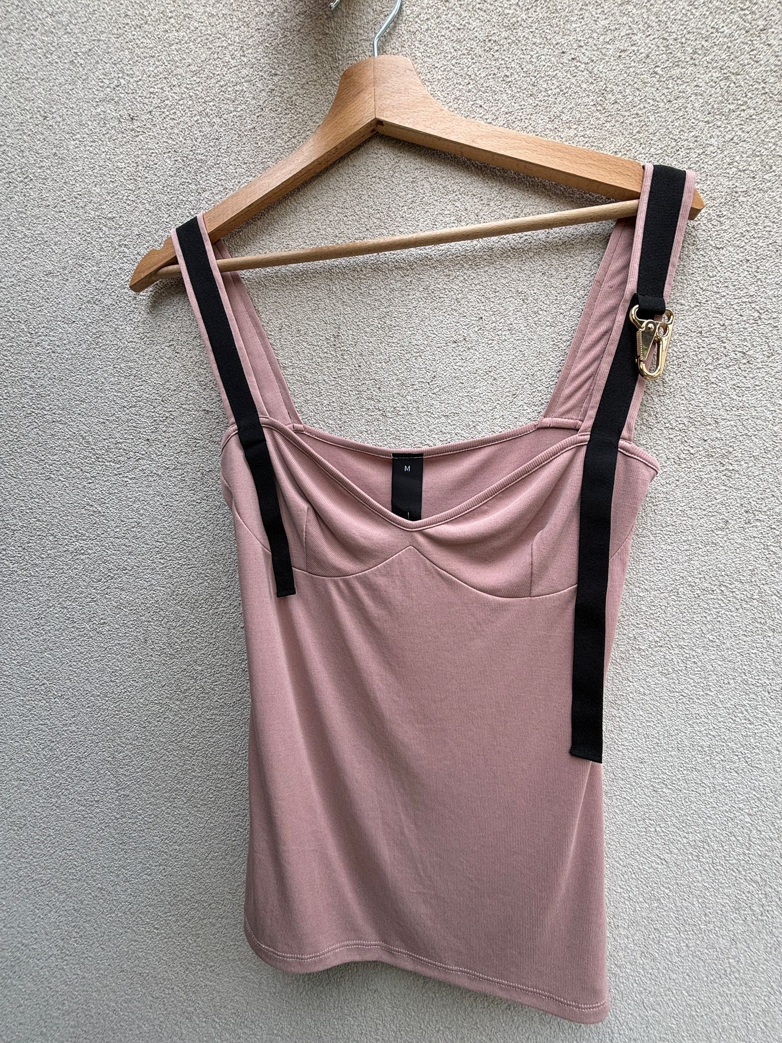 Pink top with golden trident details